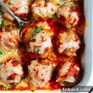 Comforting Meatball Bake 7 Close up of Baked Meatballs Casserole with a spoon lifting one meatball