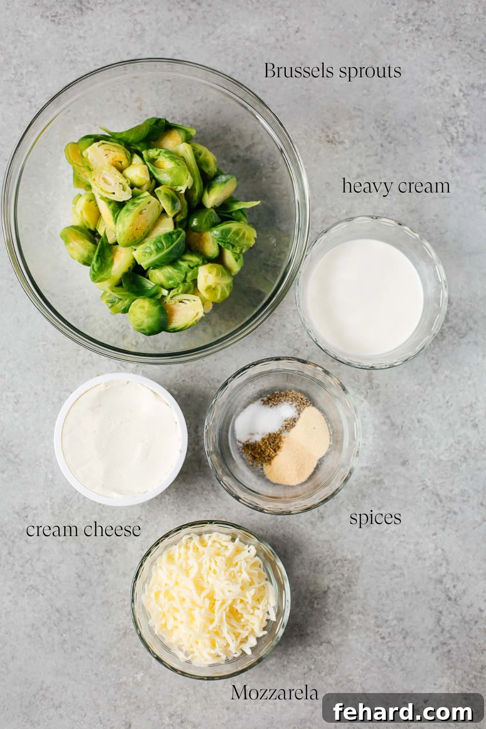 Close-up of fresh Brussels sprouts and cream cheese mixture ingredients before mixing.