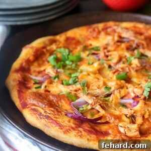 Chicken Fajita pizza topped with cilantro on tray