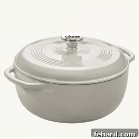 Close-up of a large, sturdy red Dutch oven, perfect for cooking hearty soups and stews.