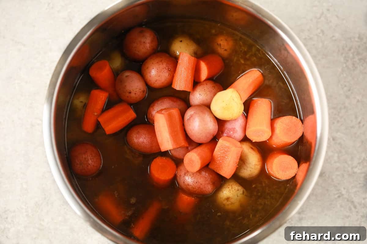 Ultimate Instant Pot Pot Roast 4 Vegetables being added to the Instant Pot.