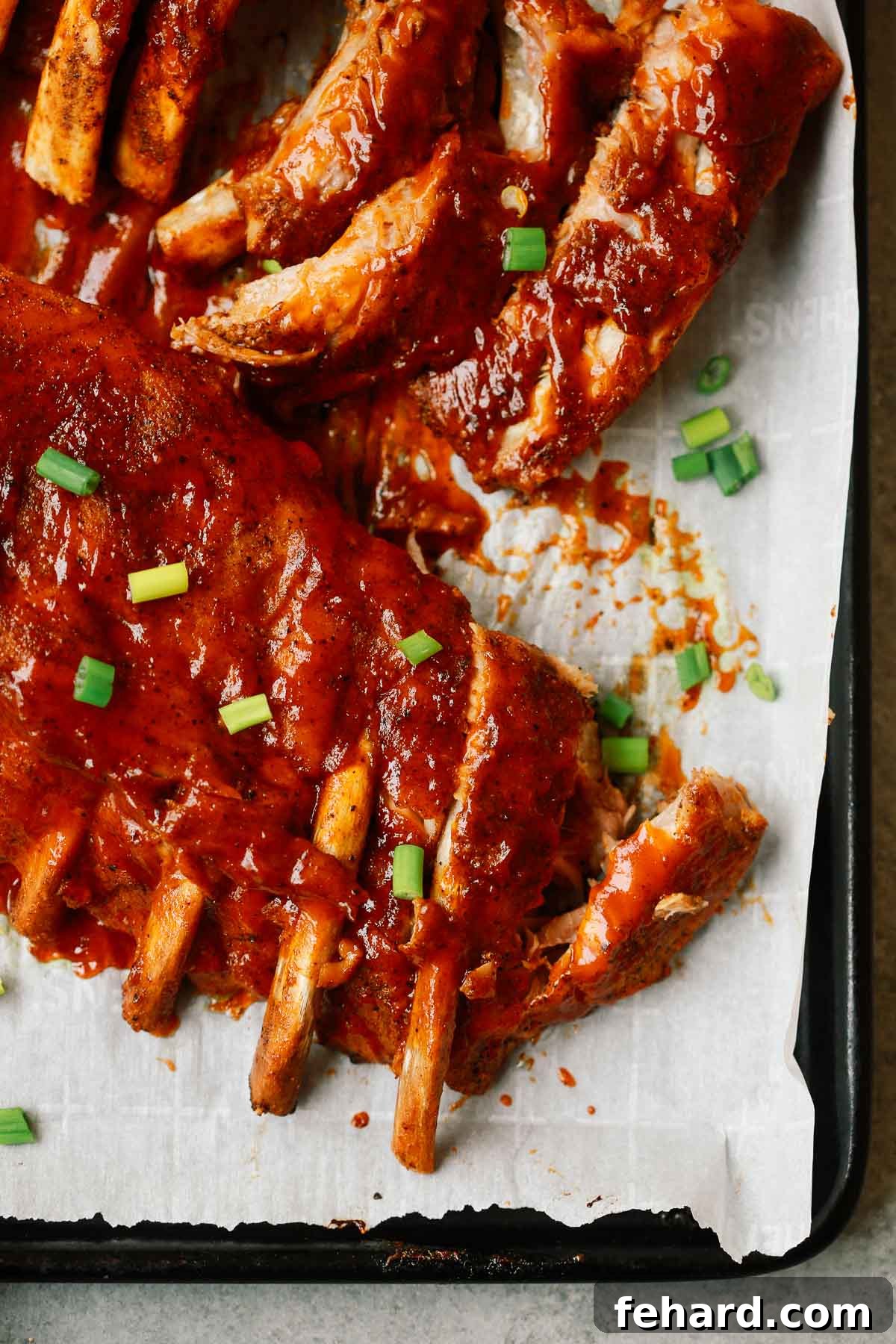 Effortlessly Tender Instant Pot Ribs 2 Close up photo of saucy Instant Pot Ribs, showcasing their tenderness and rich barbecue glaze.