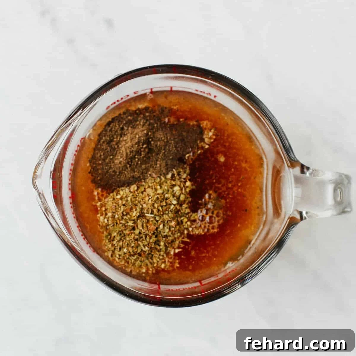 chicken broth, seasonings and cup of glass. 