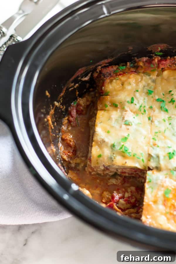 Slow Cooker Zucchini Lasagna - Delicious and ready to serve. Individual slices of Slow Cooker Zucchini Lasagna, showing the steam and fresh parsley garnish.