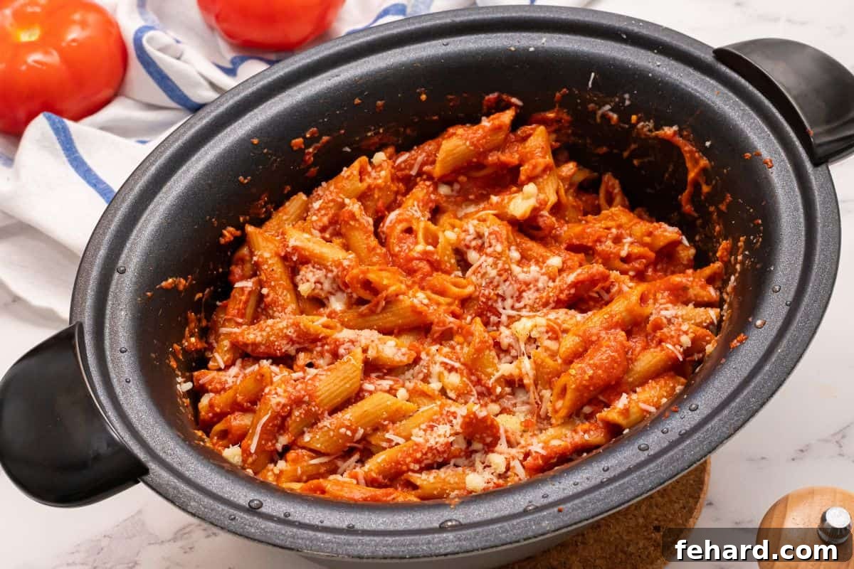 Finished Crockpot Ziti Ready to Serve Perfectly cooked ziti noodles with homemade sauce, cottage cheese, and mozzarella ready in the slow cooker.