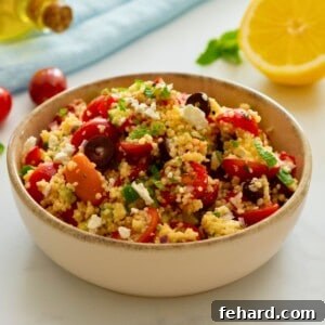Cold Couscous Salad made with olives, tomatoes, and feta.