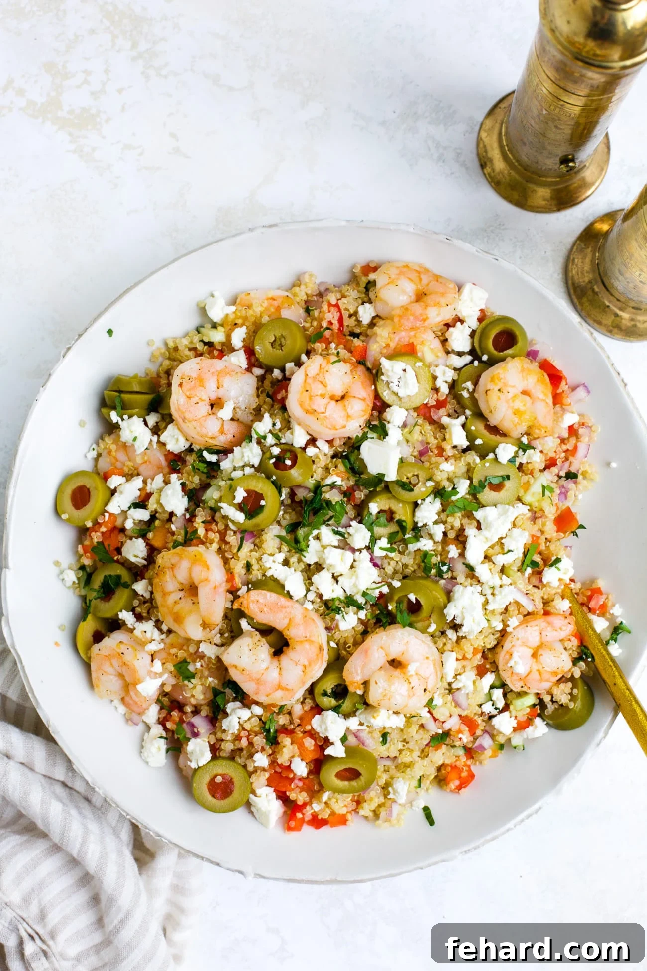 Vibrant Shrimp Quinoa Bowl 2 Overhead view of a white bowl of shrimp quinoa.