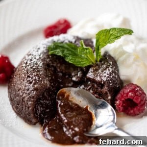 Decadent Instant Pot Lava Cakes 3 Instant Pot Lava Cake with spoon showing cutting open and chocolate oozing out.