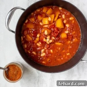 Butternut Squash Chili in dutch oven stockpan next to chili seasoning
