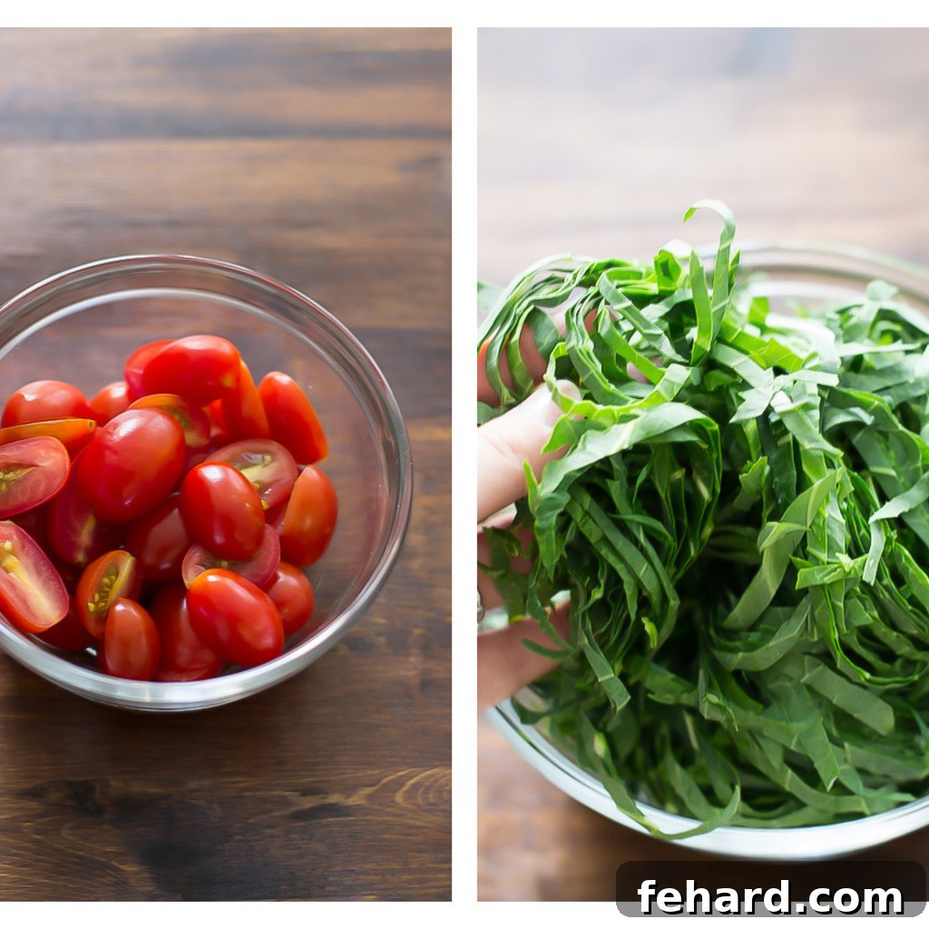 Close-up shot of vibrant cherry tomatoes and thinly sliced fresh collard greens in separate bowls, ready for preparation.