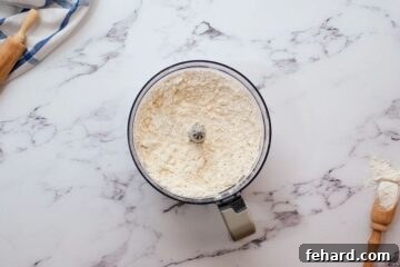 Flour with chilled butter throughout resembling crumbly sand.