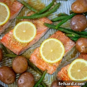 Sheet pan with salmon, potatoes, green beans.