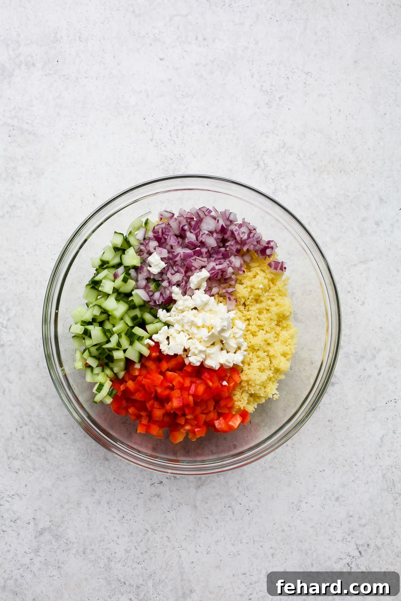 Salad ingredients measured into a large bowl.