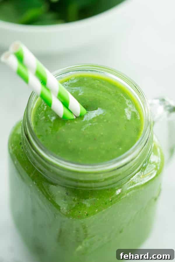 Mango Green Smoothie - Fastest Way to Get More Greens Delicious and healthy Mango Green Smoothie in a glass, ready to drink, vibrant green color.
