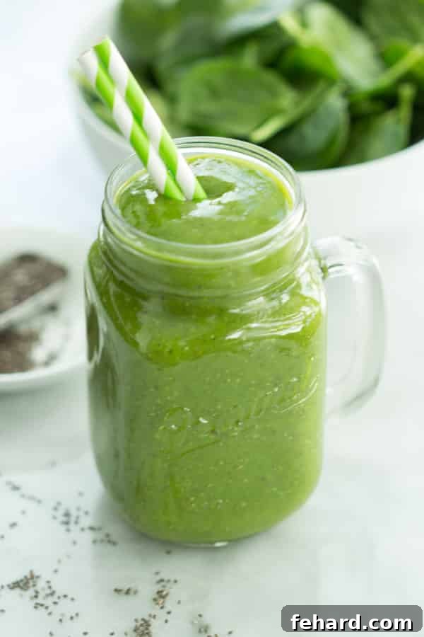 Fresh Ingredients for Mango Green Smoothie Ingredients for a Mango Green Smoothie laid out on a table, including fresh spinach, mango, and a banana.