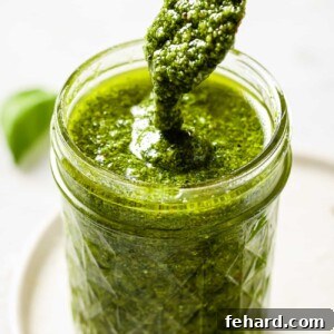 Fresh Basil Pesto in a bowl with a spoon
