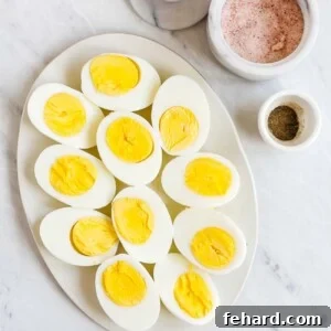 A platter of hard-boiled eggs cut in half, ready to be served.