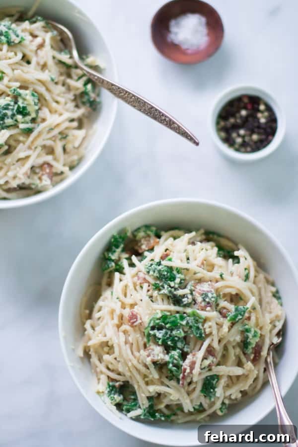 Make this classic Italian Carbonara recipe packed with eggs, cheese, bacon and kale. This is definitely a super easy, quick and rich recipe for dinner.