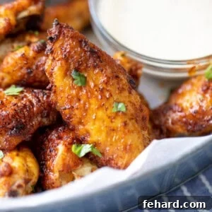 Close up of Air Fryer Chicken Wings, showcasing their golden, crispy skin and irresistible appearance.