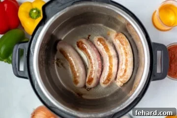 Seared Italian Sausage in inner pot of Instant Pot.