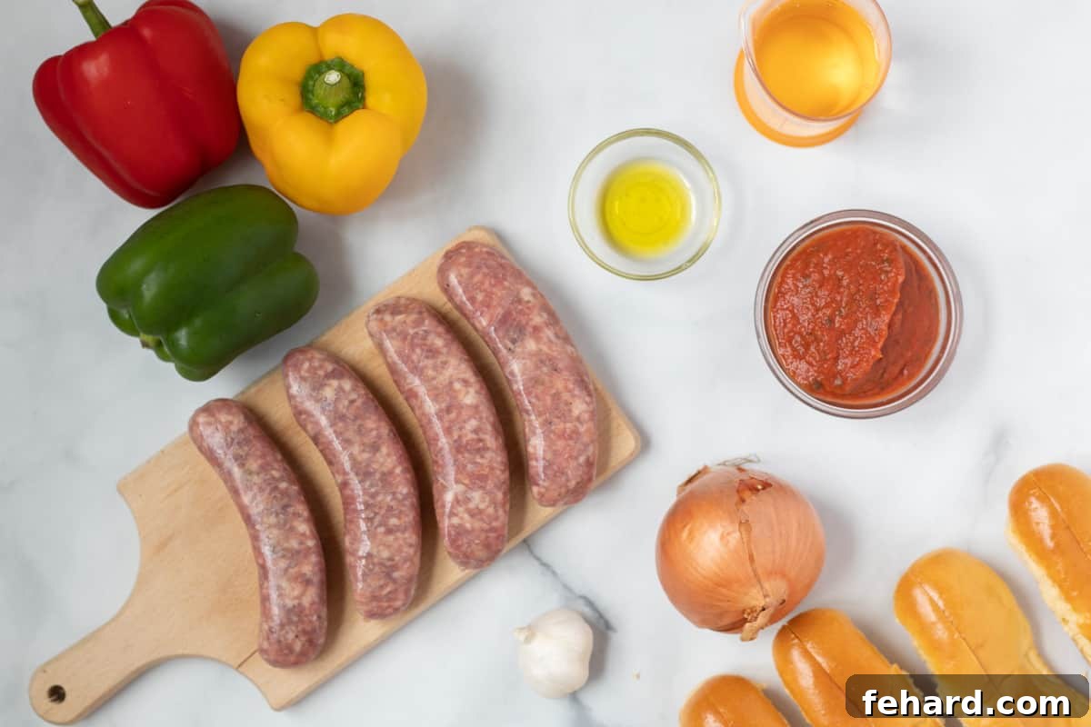 Ingredients for sausage and peppers on white counter. 