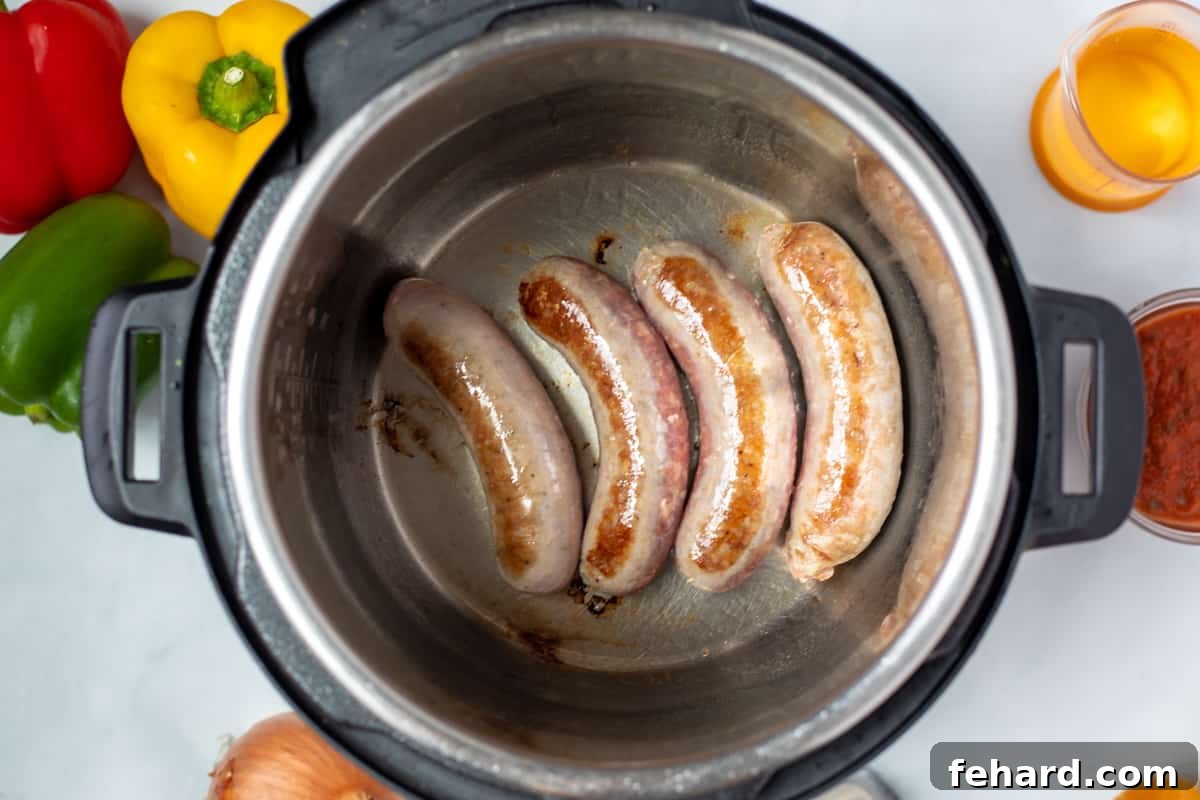 Seared Italian Sausage in inner pot of Instant Pot. 