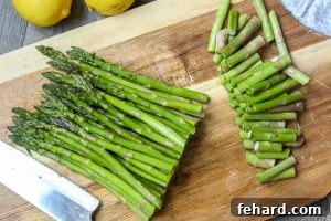Trimmed Asparagus on cutting board.