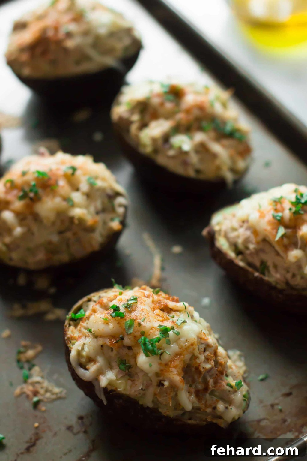 Three Avocado Tuna Boats on a plate - Healthy, quick, easy, gluten-free, dairy-free, paleo friendly, and low-carb meal idea.