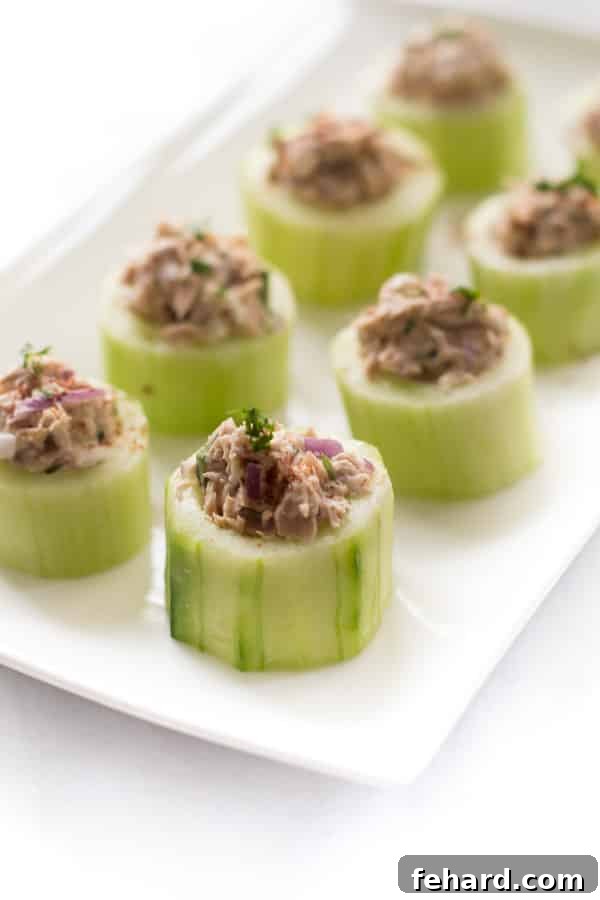 Tuna Cucumber Cups Recipe - A refreshing, low-carb appetizer or snack featuring tuna salad in crisp cucumber cups.