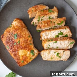 Air Fryer Pork Chops on gray plate, ready to serve.