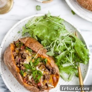 overhead view of stuffed sweet potato on a white plate