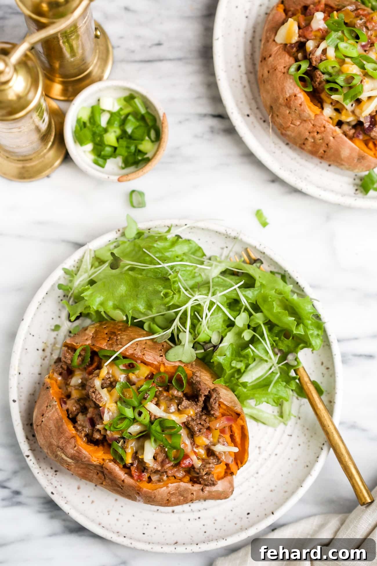 overhead view of stuffed sweet potato on a white plate