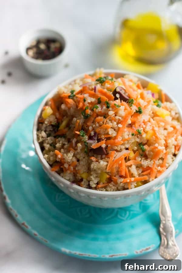 Carrot Quinoa Salad - A vibrant, flavorful, and healthy quinoa salad with carrots, bell peppers, red onions, and olives. Carrot Quinoa Salad - This quinoa salad is filled with shredded carrots, red onions, bell pepper and olives. It is gluten-free, vegan, healthy and very flavourful too.