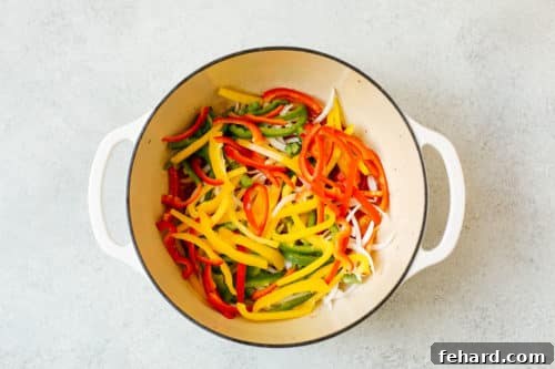 Vibrant Brazilian Fish Stew 10 overhead view of a Dutch Oven Pot containing bell pepper and onions