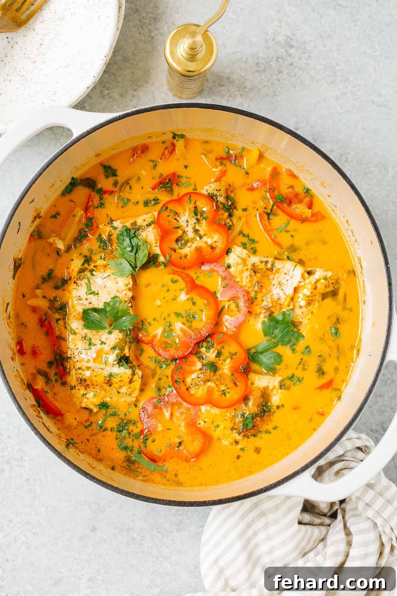 Vibrant Brazilian Fish Stew 4 Overhead view of a pot of Brazilian fish stew.