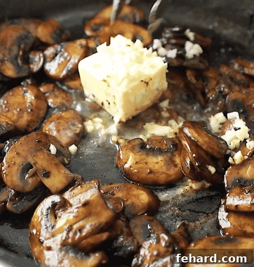 close up of sautéed mushroom with garlic and butter