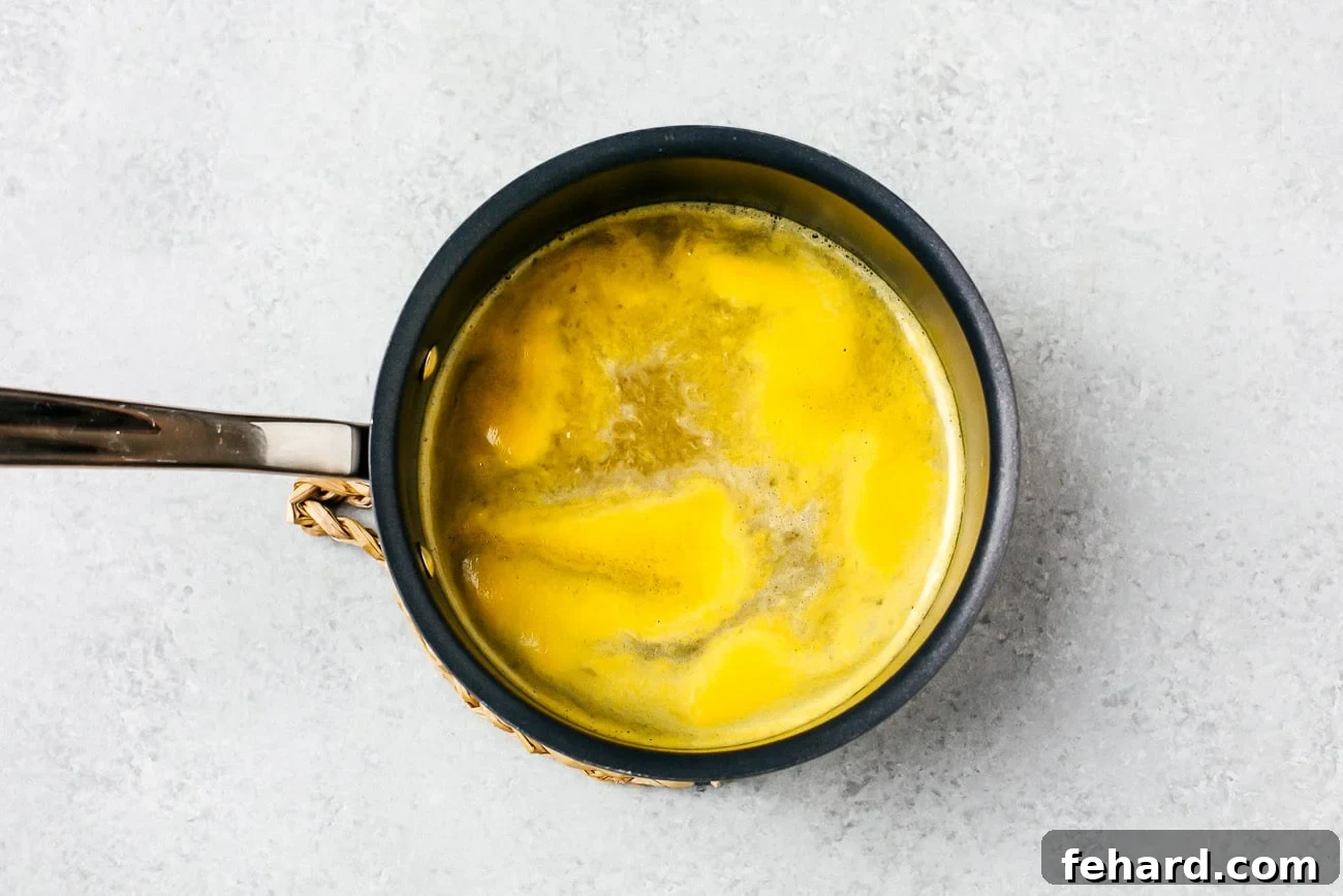 orange juice, maple and vanilla extract in a pot