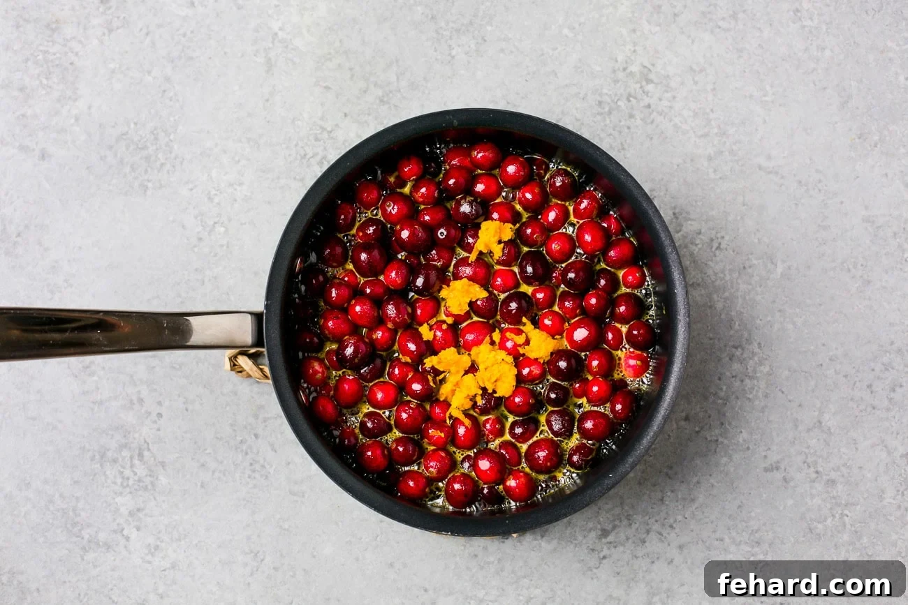 cranberries and orange zest in a pot