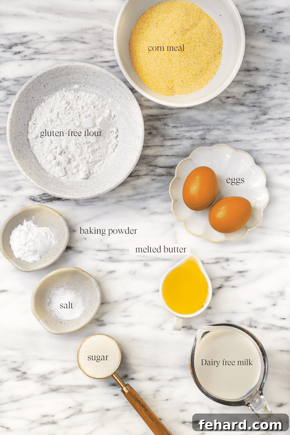 gluten free cornbread ingredients on a marble countertop.