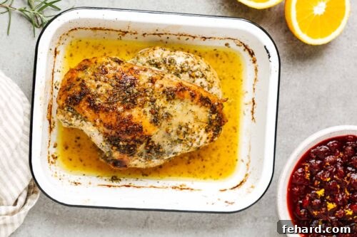garlic butter turkey breast in a baking sheet.