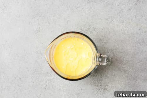 Golden Baked Cheesy Potatoes 12 heavy cream and melted butter in a cup