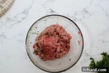 Mixing bowl with meatball mixture for baked Italian meatballs.