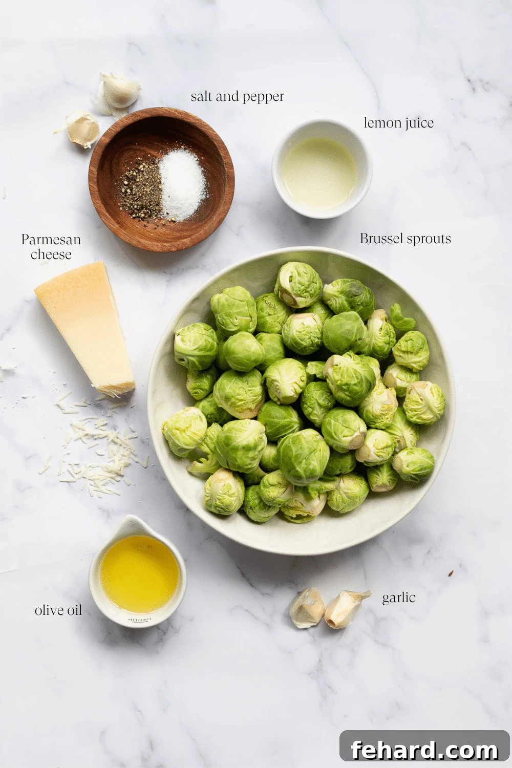 ingredients to make roasted brussel sprouts on a marble countertop
