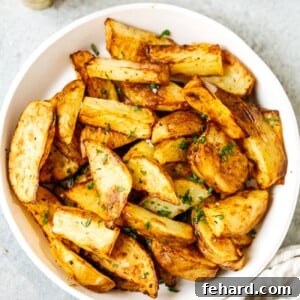 overhead view of air fryer potato wedges