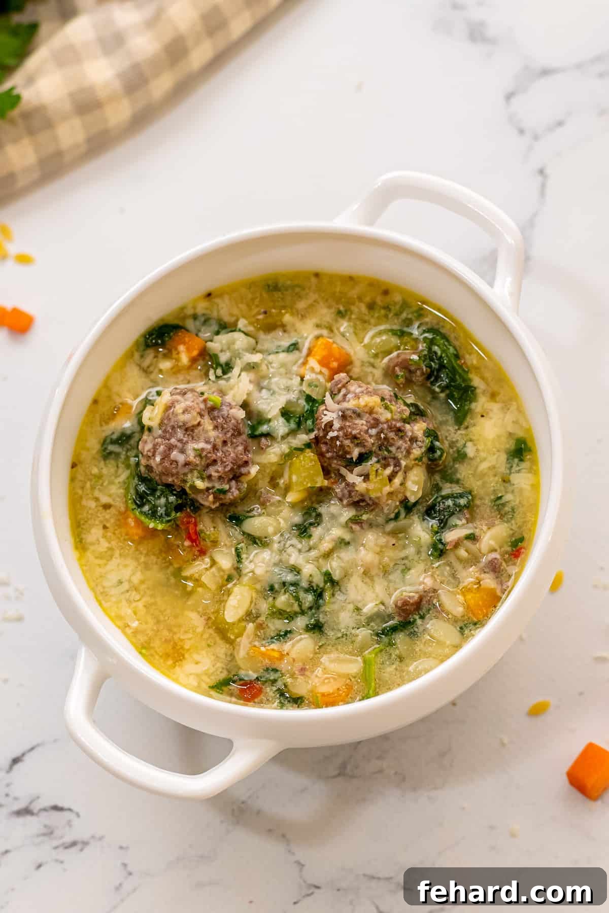 Wedding Soup Recipe Bowl of wedding soup with meatballs.