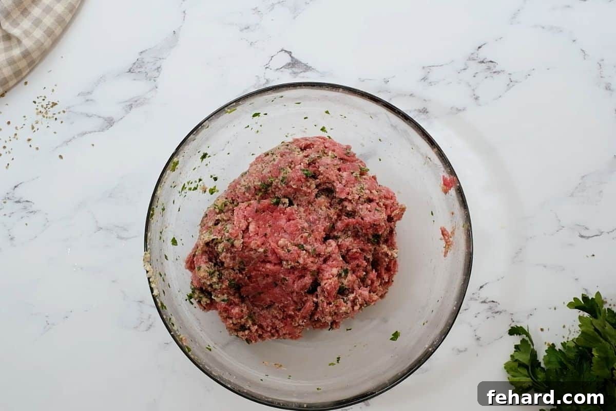 Meatball Soup Mixing bowl with meatball mixture for baked Italian meatballs.