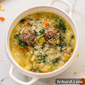 Bowl of Italian Wedding Soup in white bowl.