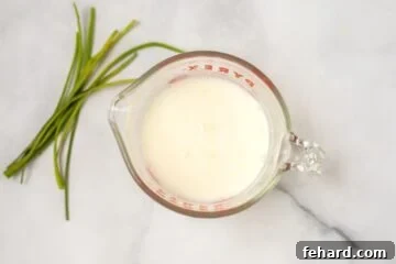 Milk and flour mixture in a measuring cup, whisked smooth.