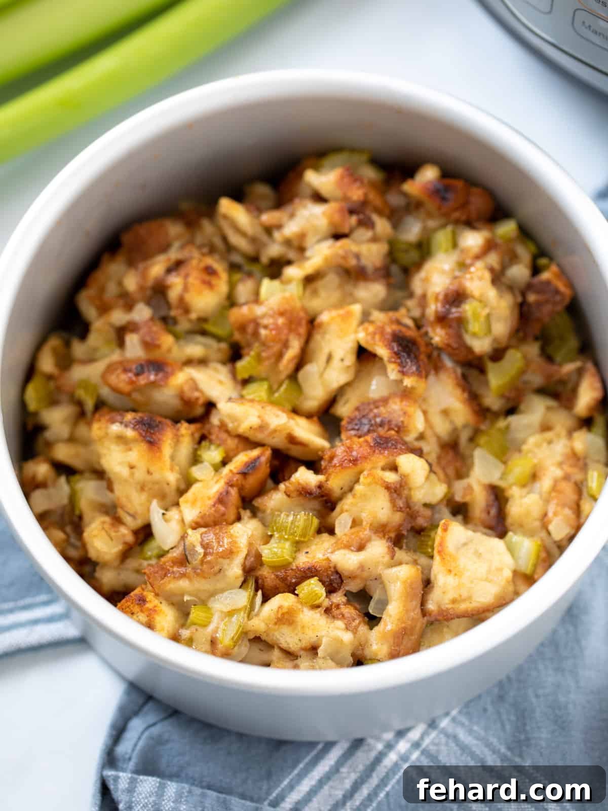 Golden brown Instant Pot Stuffing in a cake pan, ready to serve, next to an Instant Pot. 