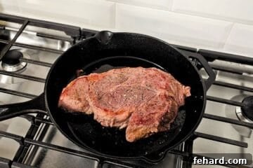 Seared chuck roast in dutch oven skillet.